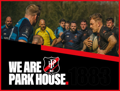 Players and coaches showing respect in a huddle