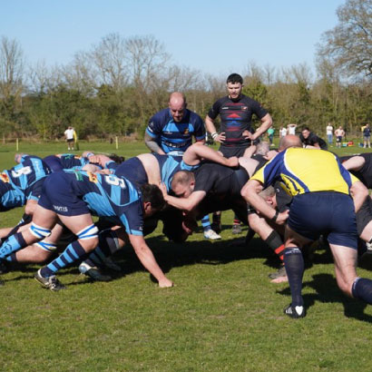 Team huddle at full time thanking supporters