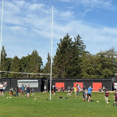 Parents and junior players smiling after training session